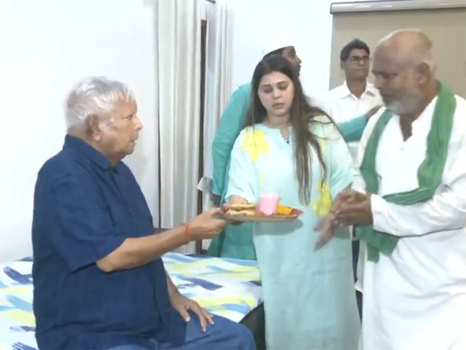 RJD workers extend their wishes to RJD chief Lalu Prasad Yadav on his birthday. (Photo/ANI)