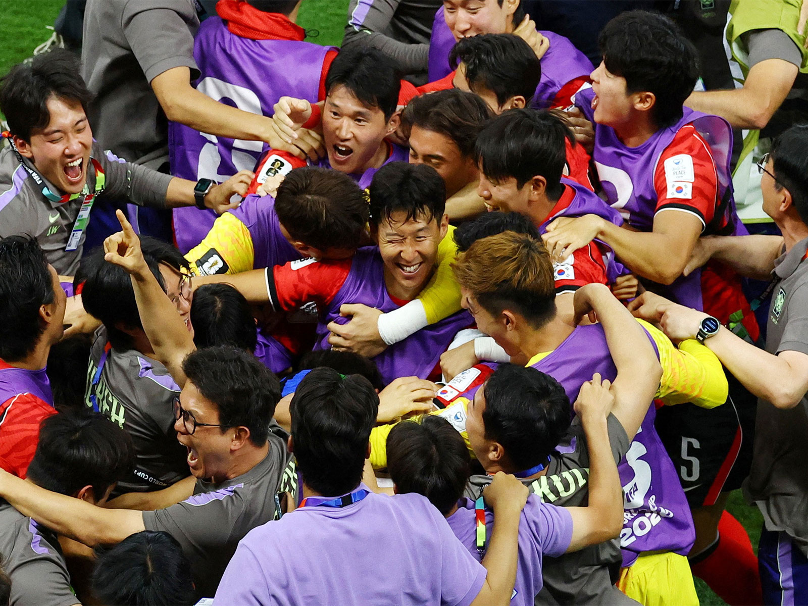South Korea's Son Heung-min celebrates with teammates and coach Hong Myung-bo after the match. (Photo: Reuters)