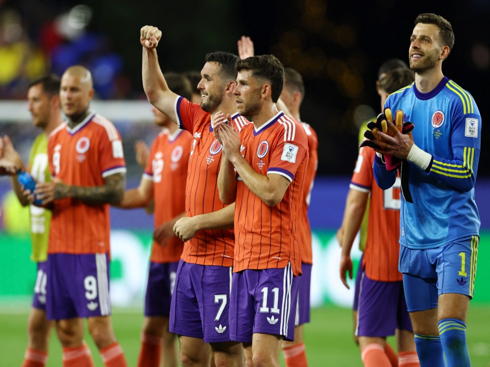 Football - FIFA World Cup 2026 - Group C - Haiti v Scotland - Boston Stadium, Foxborough, Massachusetts, U.S. - June 13, 2026 Scotland's John McGinn celebrates as Ryan Christie and Angus Gunn applaud fan. (Photo: Reuters)