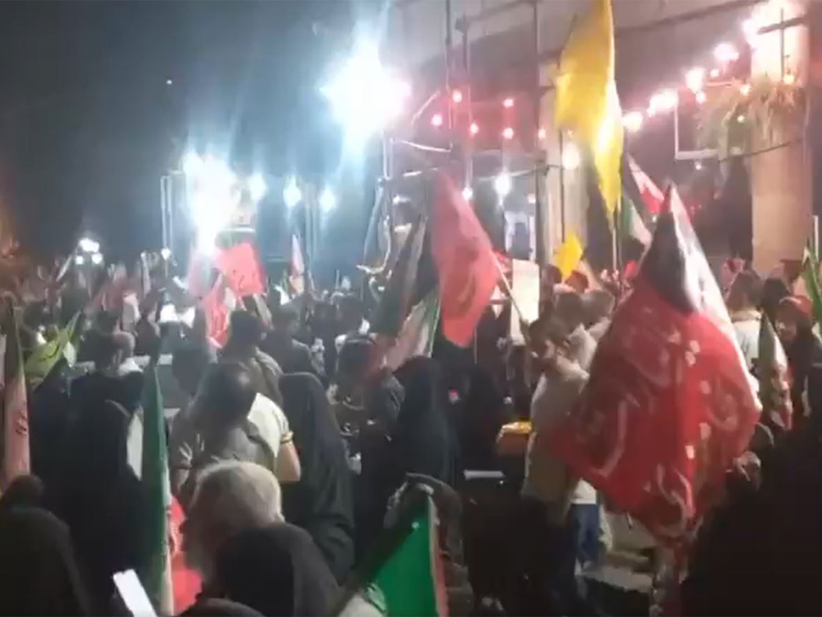 People protest against a peace deal with US outside an Iran foreign ministry office. (Image Source: Iranian state media)