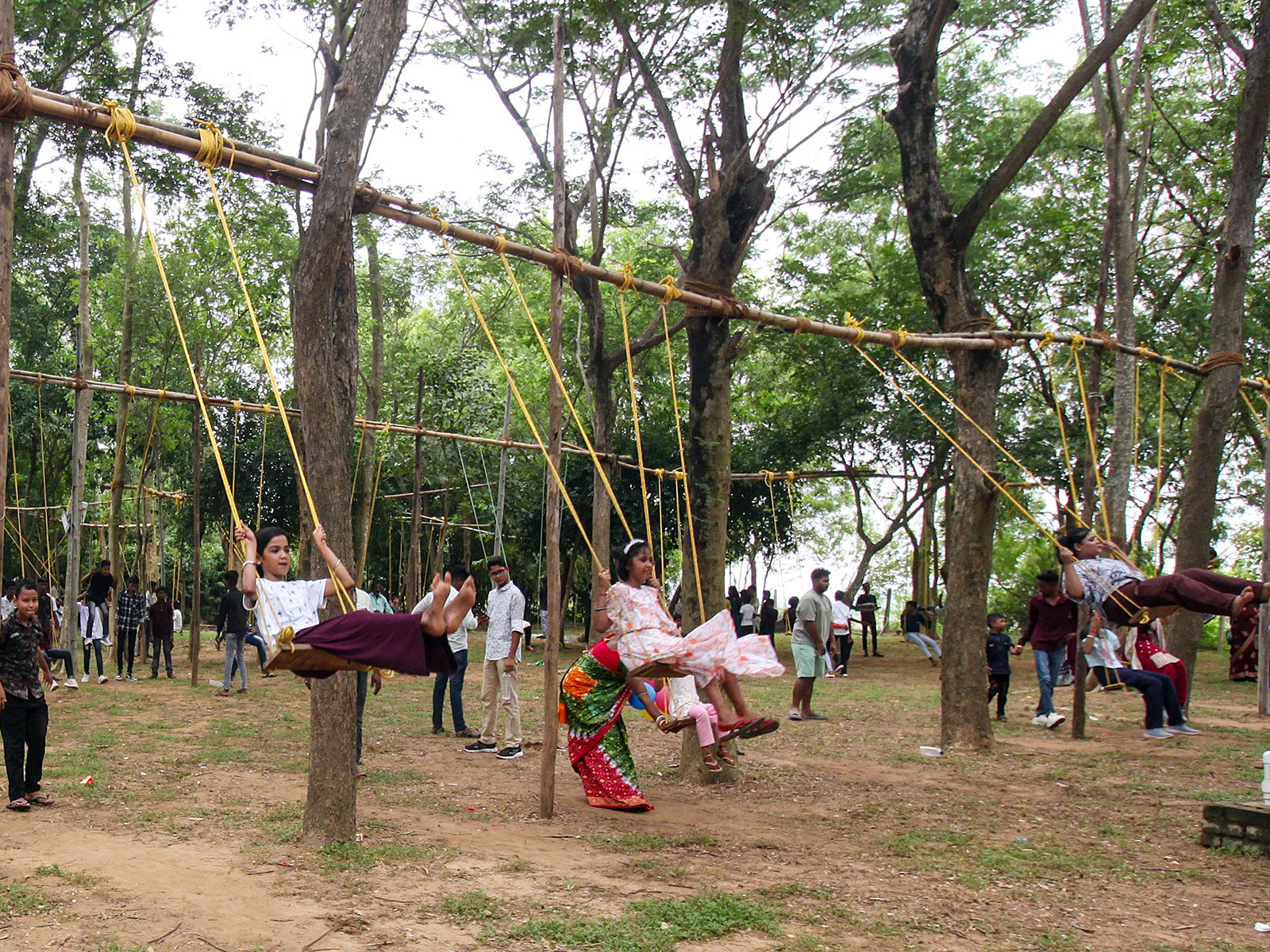 Girls swing on the occasion of 'Raja' festival in Odisha (Photo/ANI)