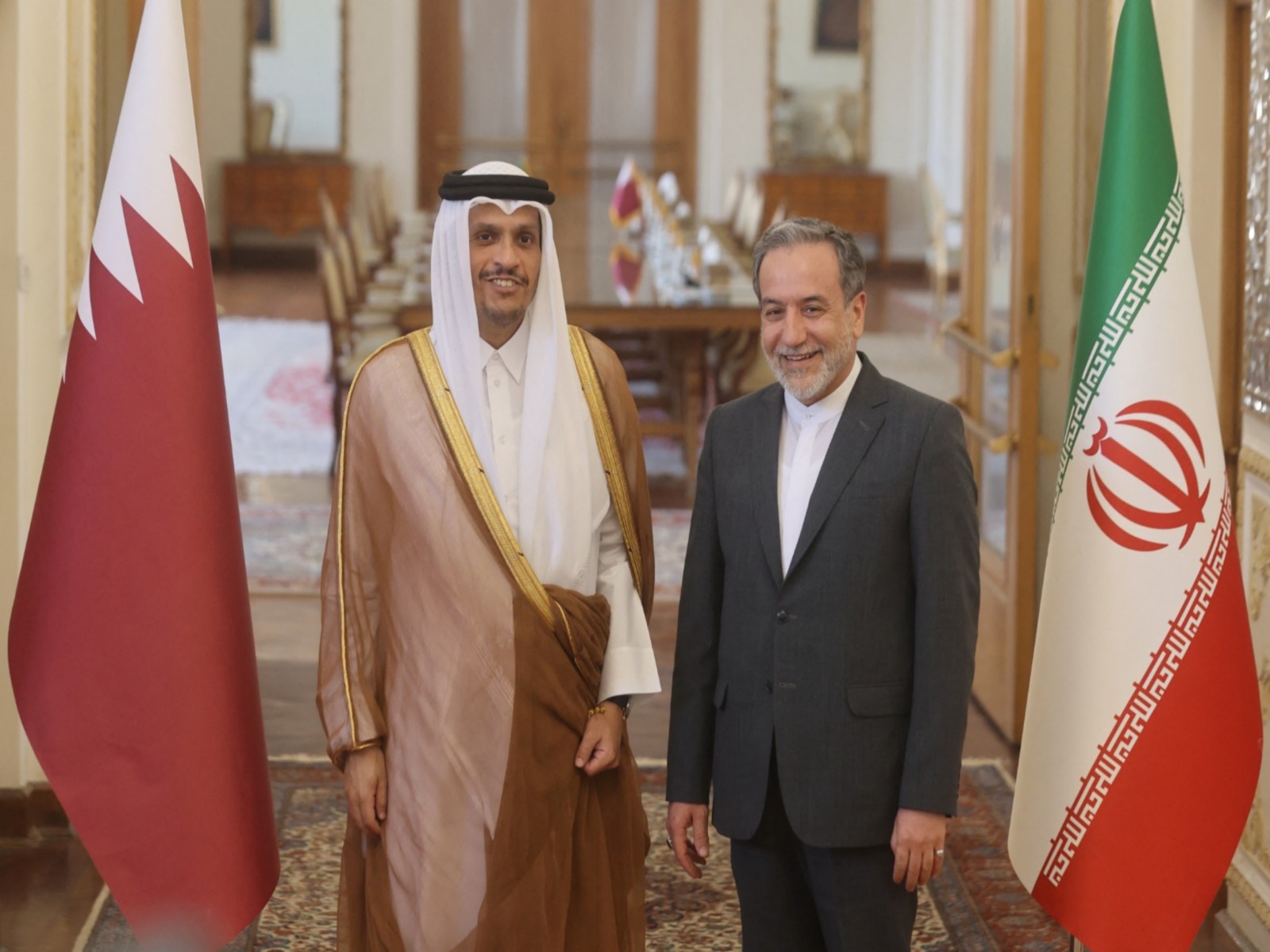 Iranian Foreign Minister Abbas Araghchi with Qatari Prime Minister Sheikh Mohammed bin Abdulrahman Al Thani, meeting in August 2024(File Photo/Reuters)