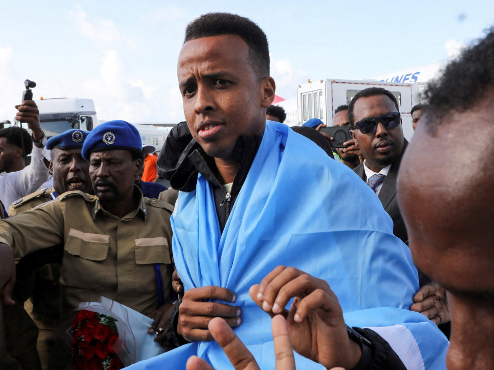 Somali referee Omar Abdulkadir Artan, who had been expected to officiate at matches during the 2026 FIFA World Cup but was denied entry to the United States, is received as he arrives at the Aden Abdulle Osman Internation (Photo: Reuters/Feisal Omar)