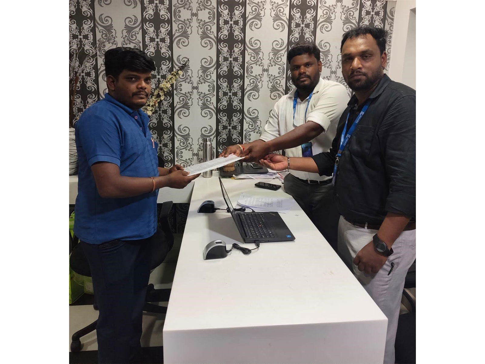 G Square representatives present the documents for Tamil Nadu's first-ever presenceless property registration to Mr. Balamurugan.