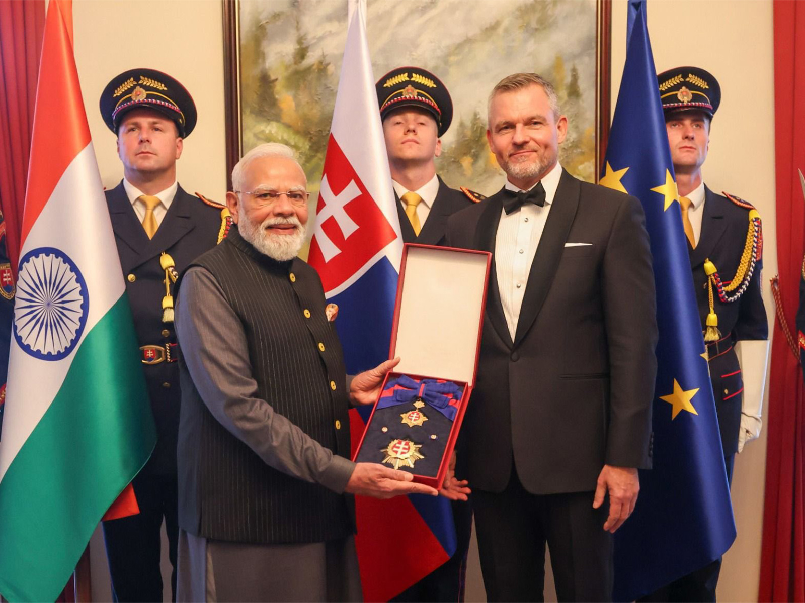 Slovak President Peter Pellegrini conferres its highest honour, the Order of the White Double Cross (1st Class) on PM Narendra Modi (Photo/ANI)