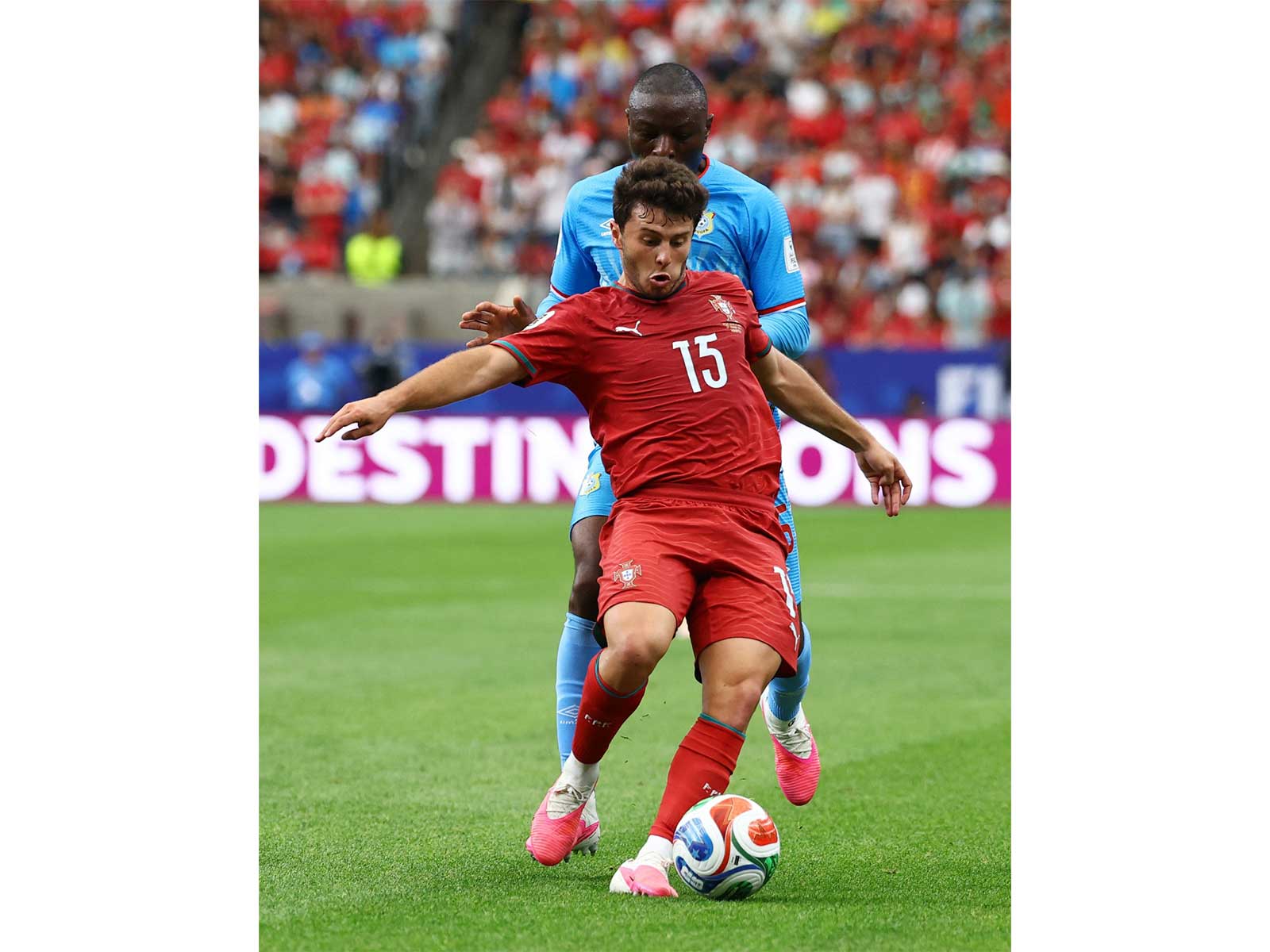 Portugal's Joao Neves in action with DR Congo's Edo Kayembe (Photo/Reuters)