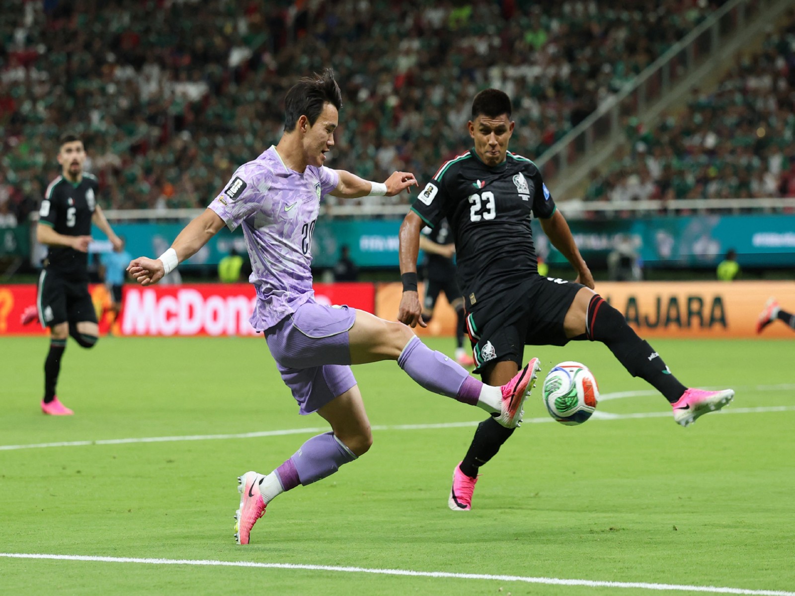 Soccer Football - FIFA World Cup 2026 - Mexico v South Korea - Guadalajara, Mexico - South Korea's Yang Hyun-jun in action with Mexico's Jesus Gallardo. (Photo: Reuters/Paul Childs)