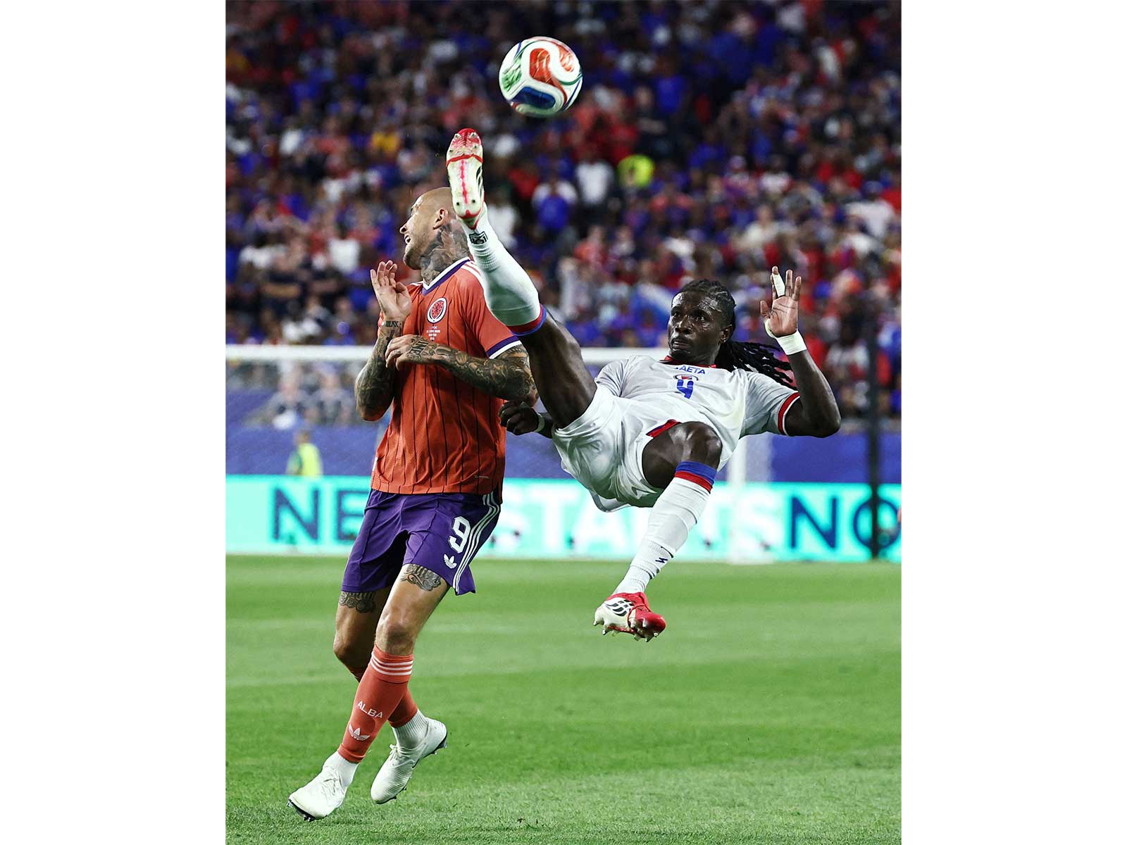 Soccer Football -FIFA World Cup 2026 - Group C - Haiti v Scotland - Boston Stadium, Foxborough, Massachusetts, U.S. - June 13, 2026 Haiti's Ricardo Ade in action with Scotland's Lyndon Dykes. (Photo: IMAGN IMAGES via Reuters/Winslow Townson)