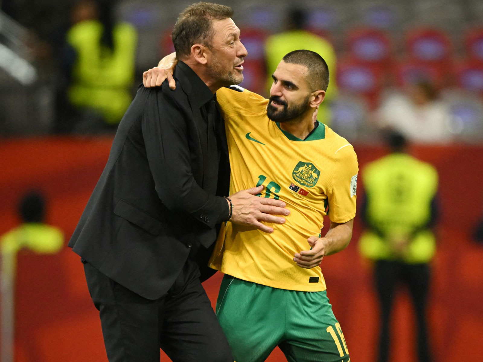 FIFA World Cup 2026 - Group D: Australia's Aziz Behich celebrates with coach Tony Popovic after the win against Turkey (Photo: Reuters/Anne-Marie Sorvin)