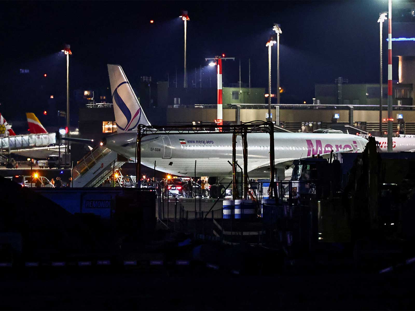 A convoy next to a plane after it landed, carrying an Iranian delegation led by chief negotiator Mohammad Baqer Qalibaf and Foreign Minister Abbas Araghchi, at the Zurich International Airport (Photo/Reuters)
