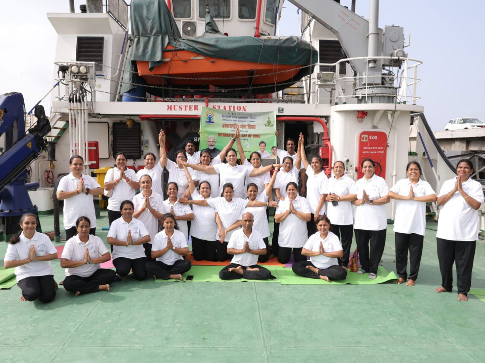 DPA officials and Women Employees Group perform yoga onboard a tug vessel during International Day of Yoga 2026 celebrations at Kandla (Photo/X/@Deendayal_Port)