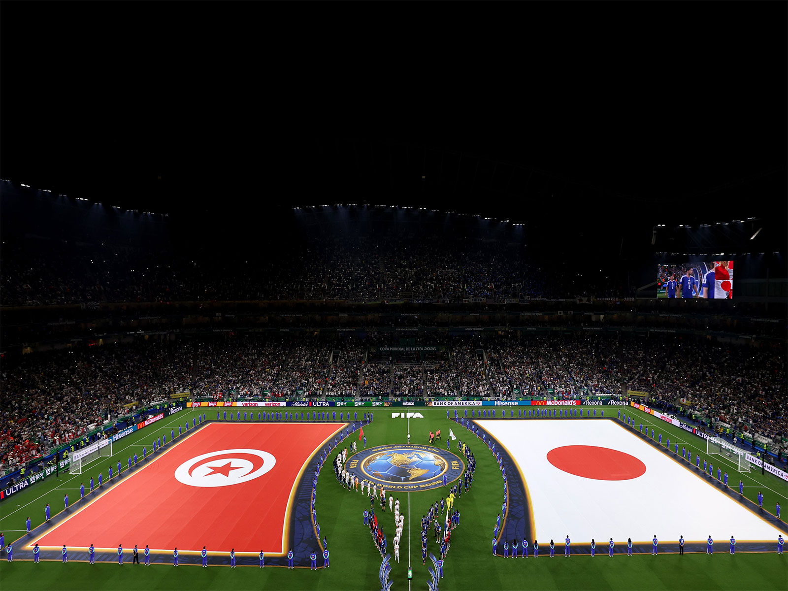 Tunisia (L) and Japan players for the national anthem before the 1000th FIFA World Cup match. (Photo: X/ @FIFAcom)