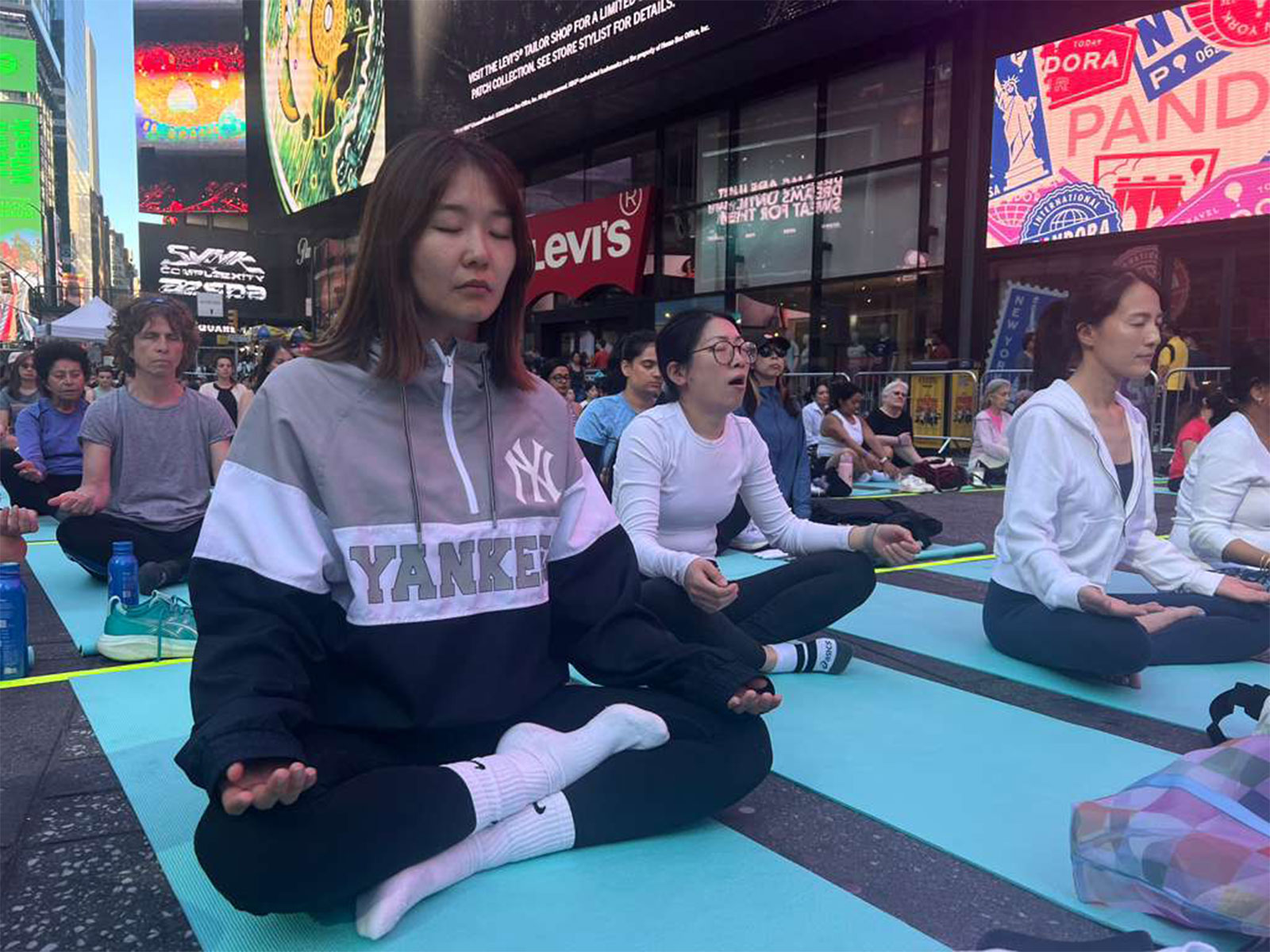 Om chants echo across Times Square in New York on International Yoga Da (Photo/ANI)