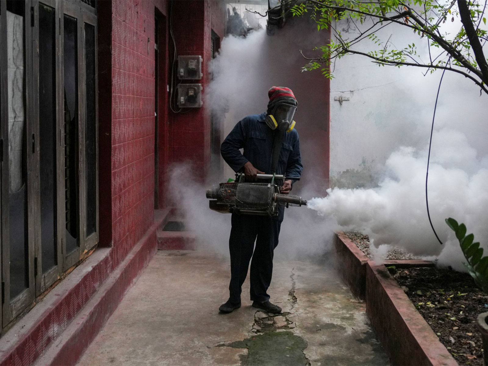 Medical Health Officer (MHO) fumigating a residential area in Sri Lanka (Photo/Reuters)-