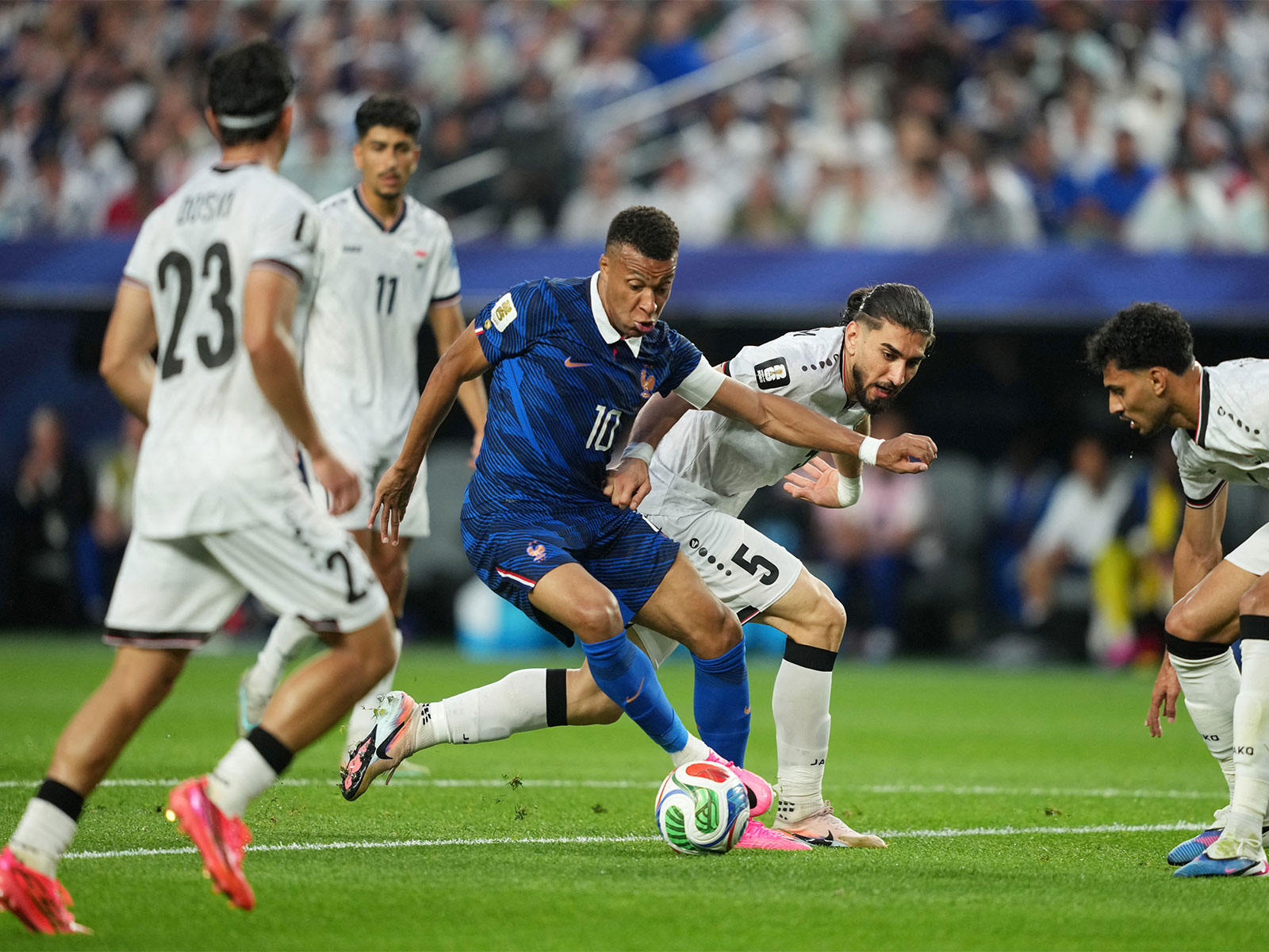 France's Kylian Mbappe in action against Iraq's players (Photo: IMAGN IMAGES via Reuters)