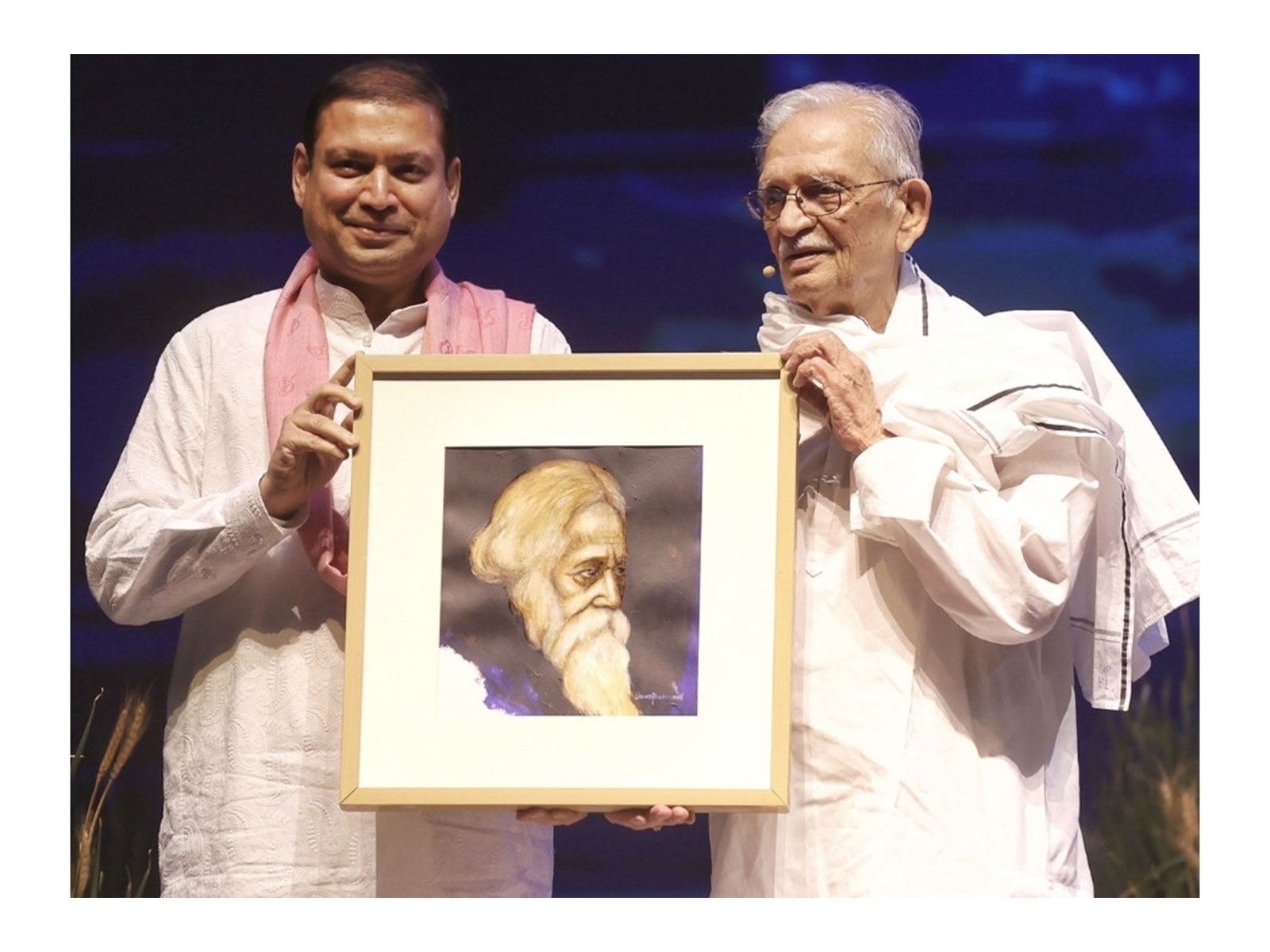 Mr Sundeep Bhutoria, culturalist, presenting a Suvaprasanna-painting of Kavi Guru Rabindranath Tagore to Gulzar during World Music Day 2026 in Kolkata
