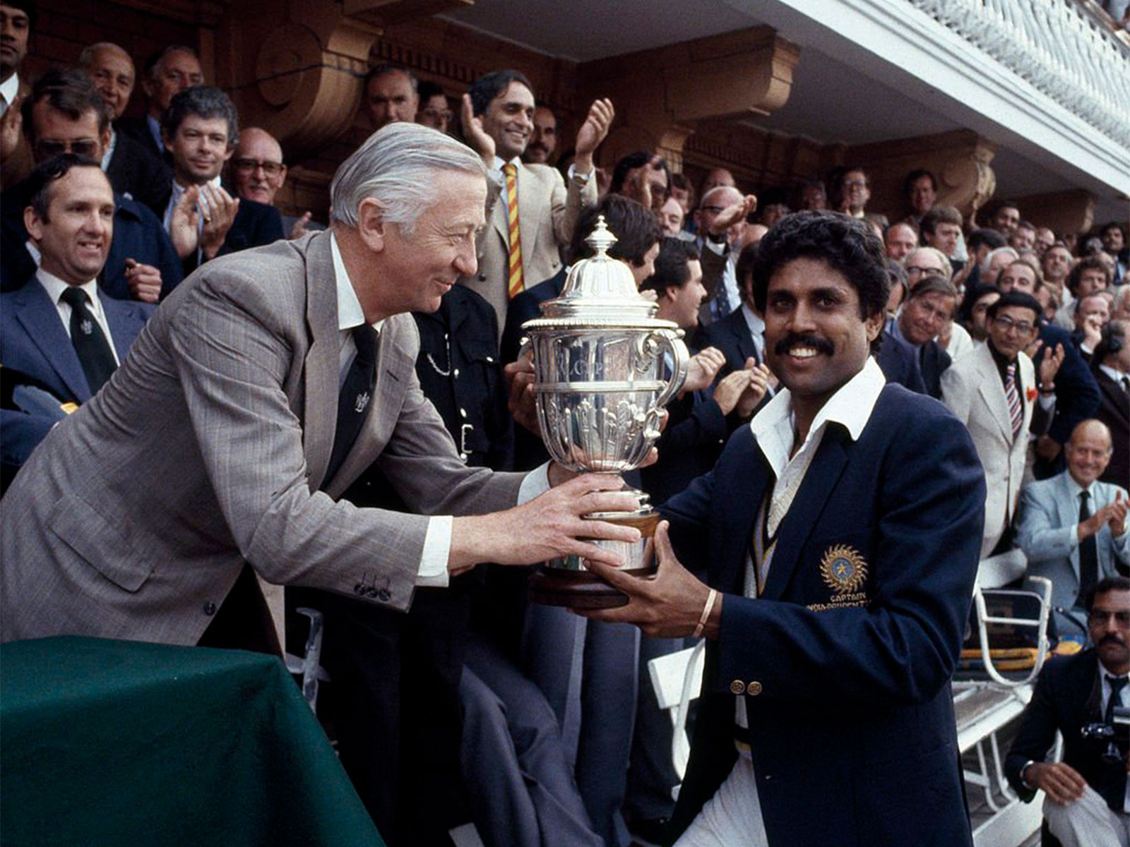Kapil Dev being handed the 1983 World Cup trophy (Photo: X/@ICC)