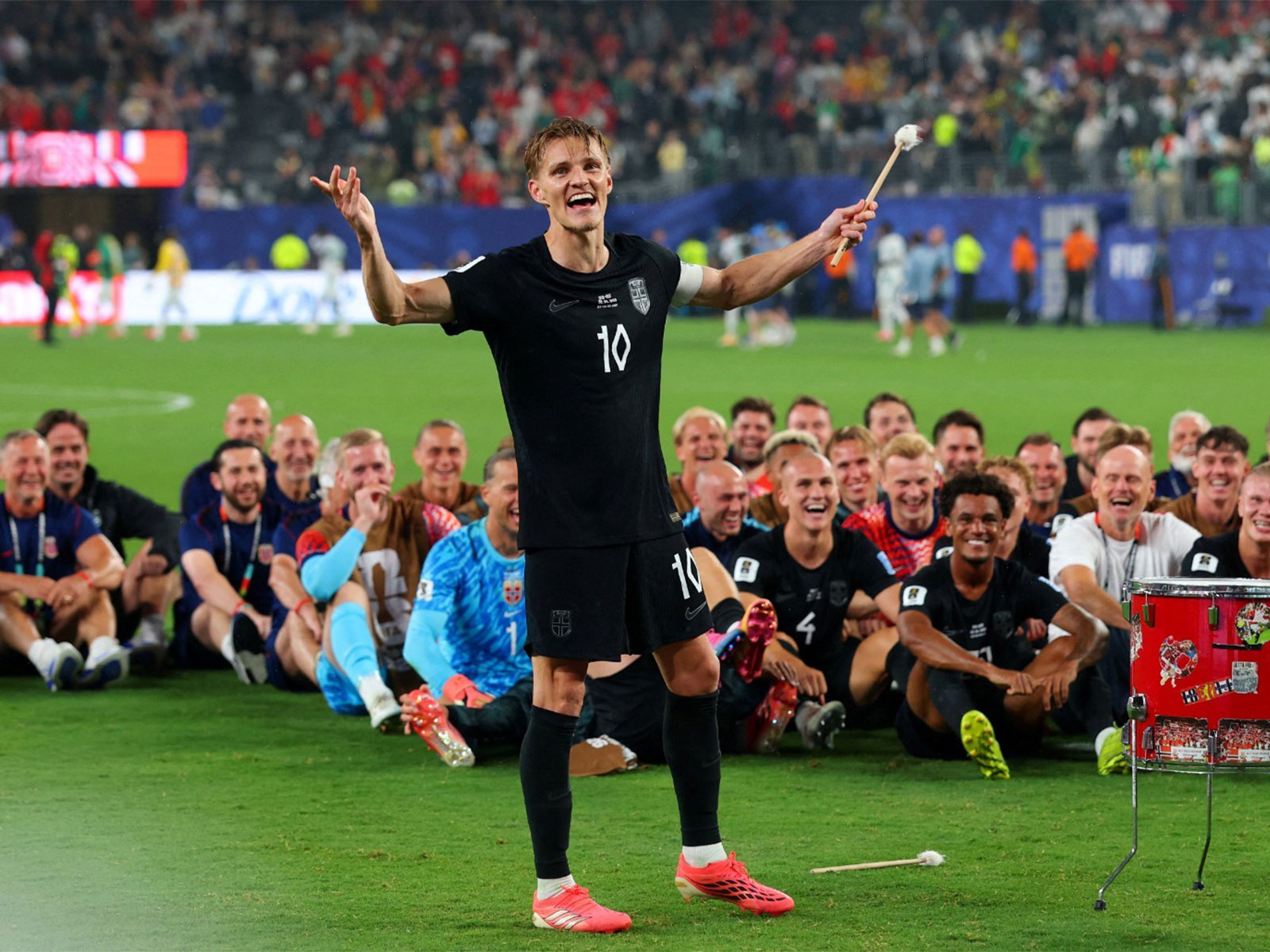 Norway team do the traditional rowing celebration with their fans after winning the match against Senegal (Photo: Reuters)