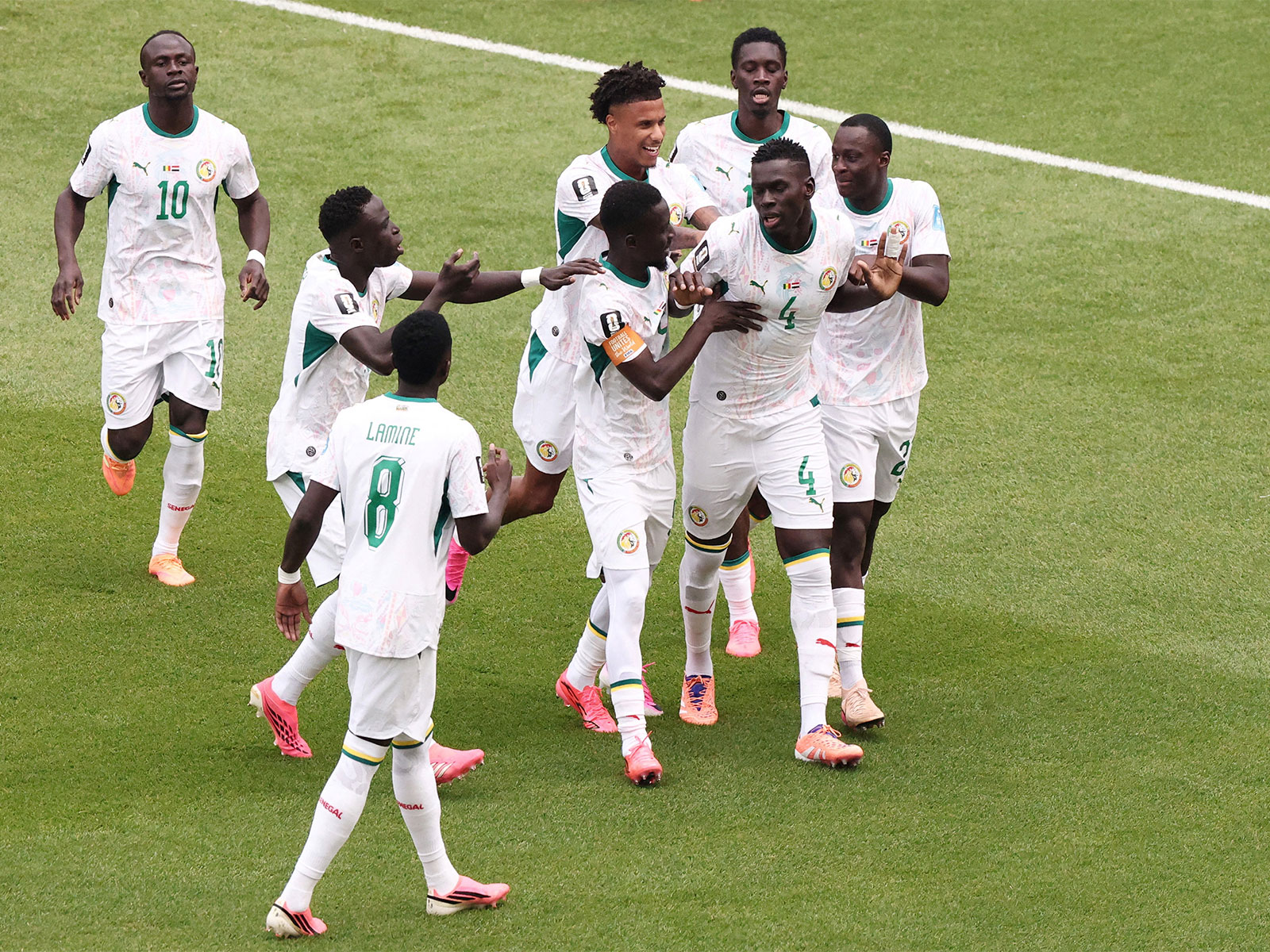 Senegal's Pape Gueye celebrates scoring their fourth goal with teammates. (Photo: IMAGN IMAGES via Reuters)