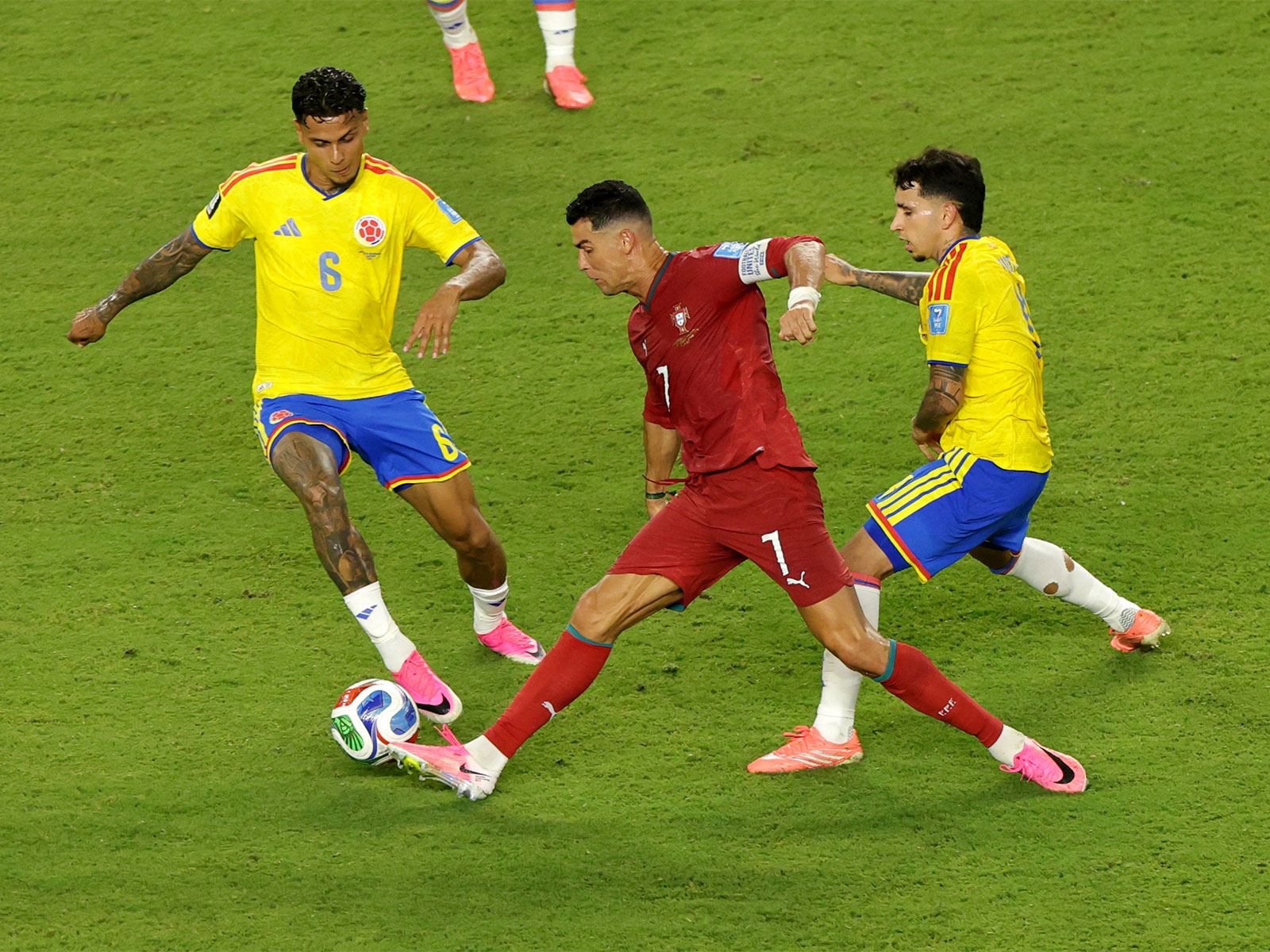 Portugal's Cristiano Ronaldo in action with Colombia's Richard Rios and Gustavo Puerta. (Photo/Reuters)
