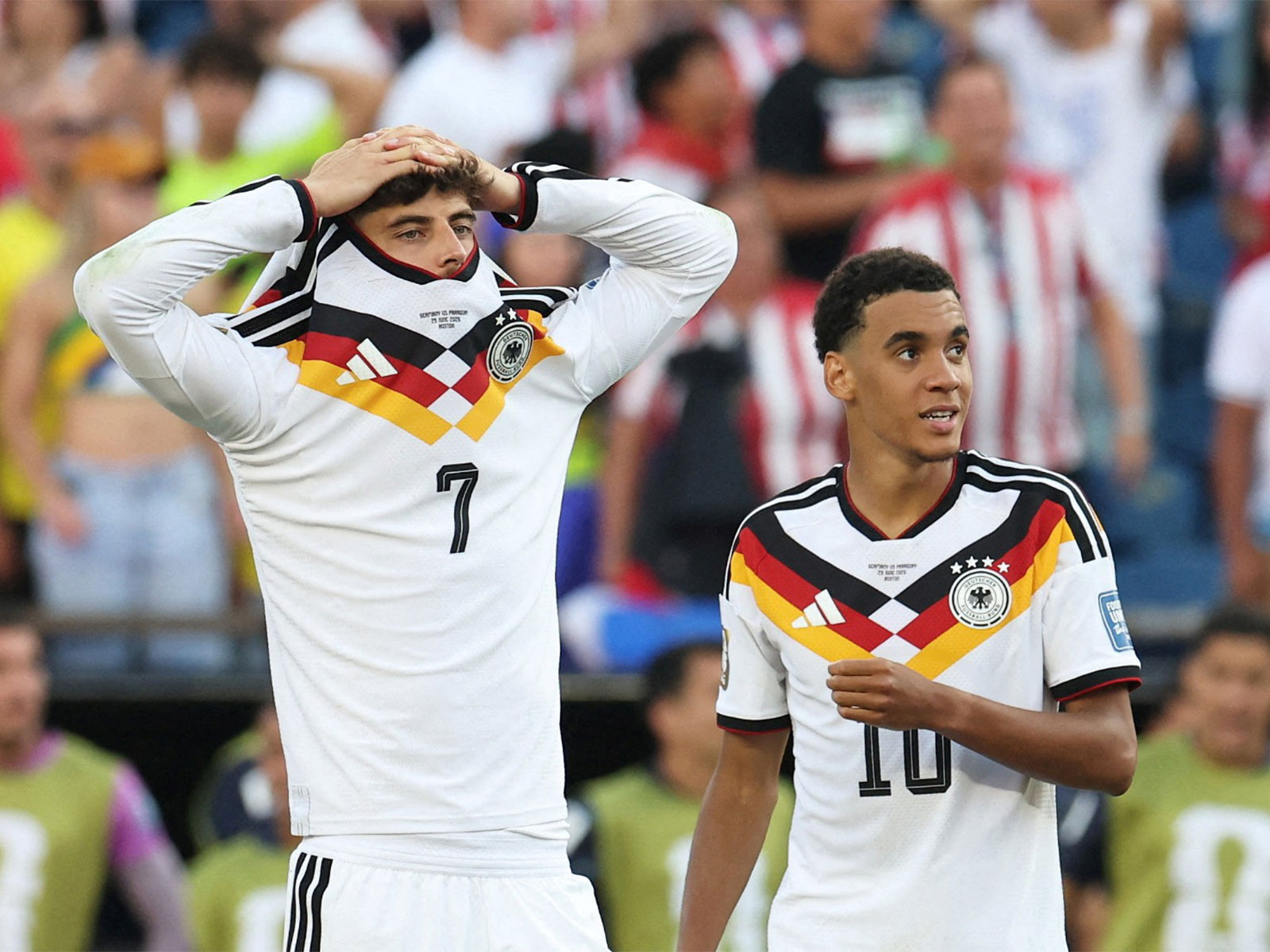 Germany's Kai Havertz and Jamal Musiala react during the penalty shootout against Paraguay (Photo: Reuters)