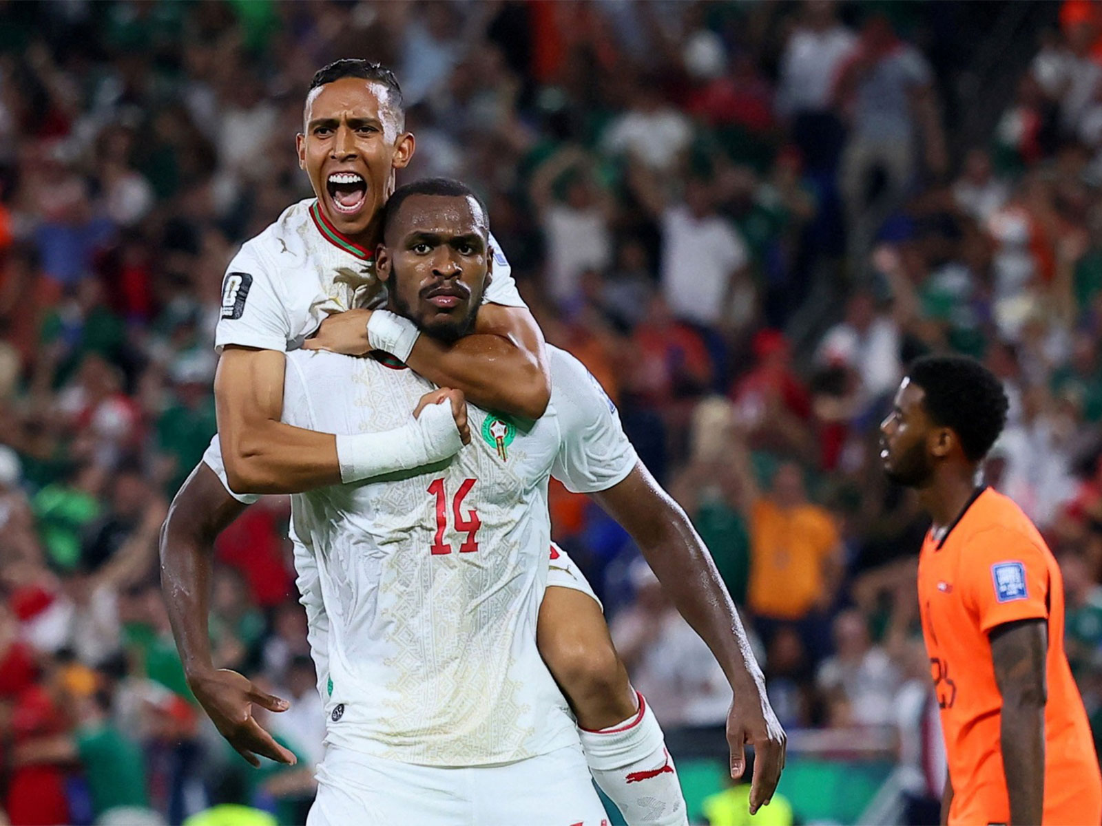 Morocco's Issa Diop celebrates scoring their first goal with Soufiane Rahimi against Netherlands (Photo: Reuters)