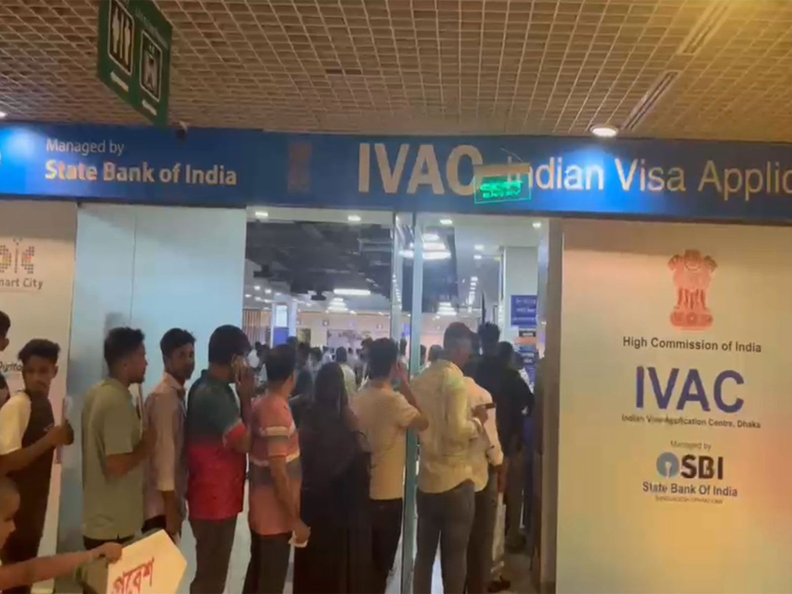 Applicants queue outside the Indian Visa Application Centre (IVAC) at Jamuna Future Park in Dhaka after the resumption of Indian tourist visa services. (Photo/ANI)