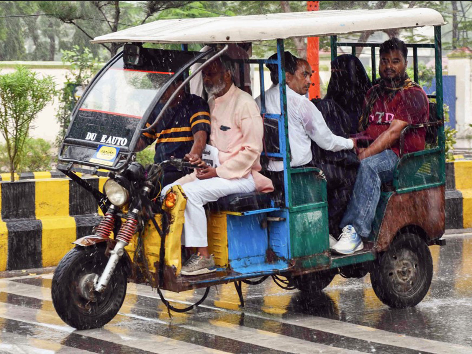 People commuting in an e-rickshaw (File Photo-ANI)