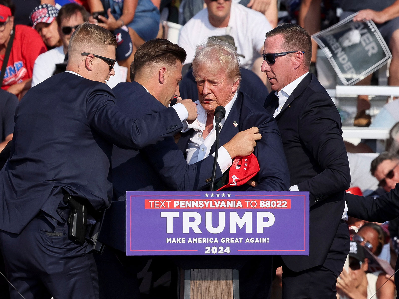 US Secret Service agents shield then-presidential candidate Donald Trump after a shooting at a campaign rally in Butler, Pennsylvania, in July 2024. (Photo/Reuters)