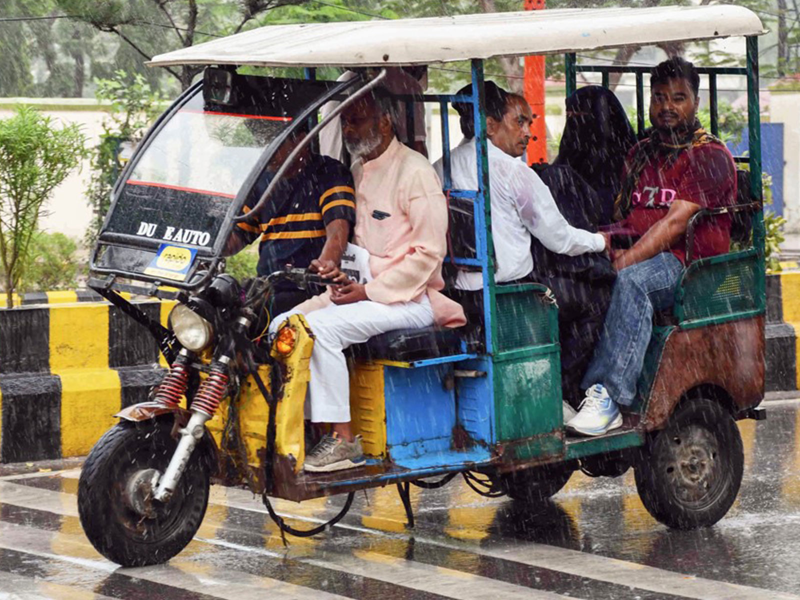 People commuting in an e-rickshaw (File Photo-ANI) 