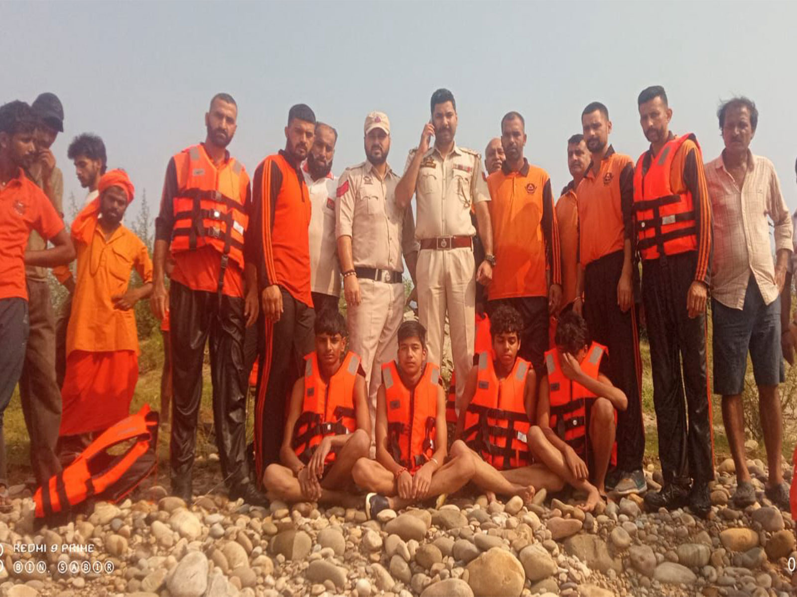 Jammu Police and the State Disaster Response Force (SDRF) along with four rescued children (Photo/ANI)