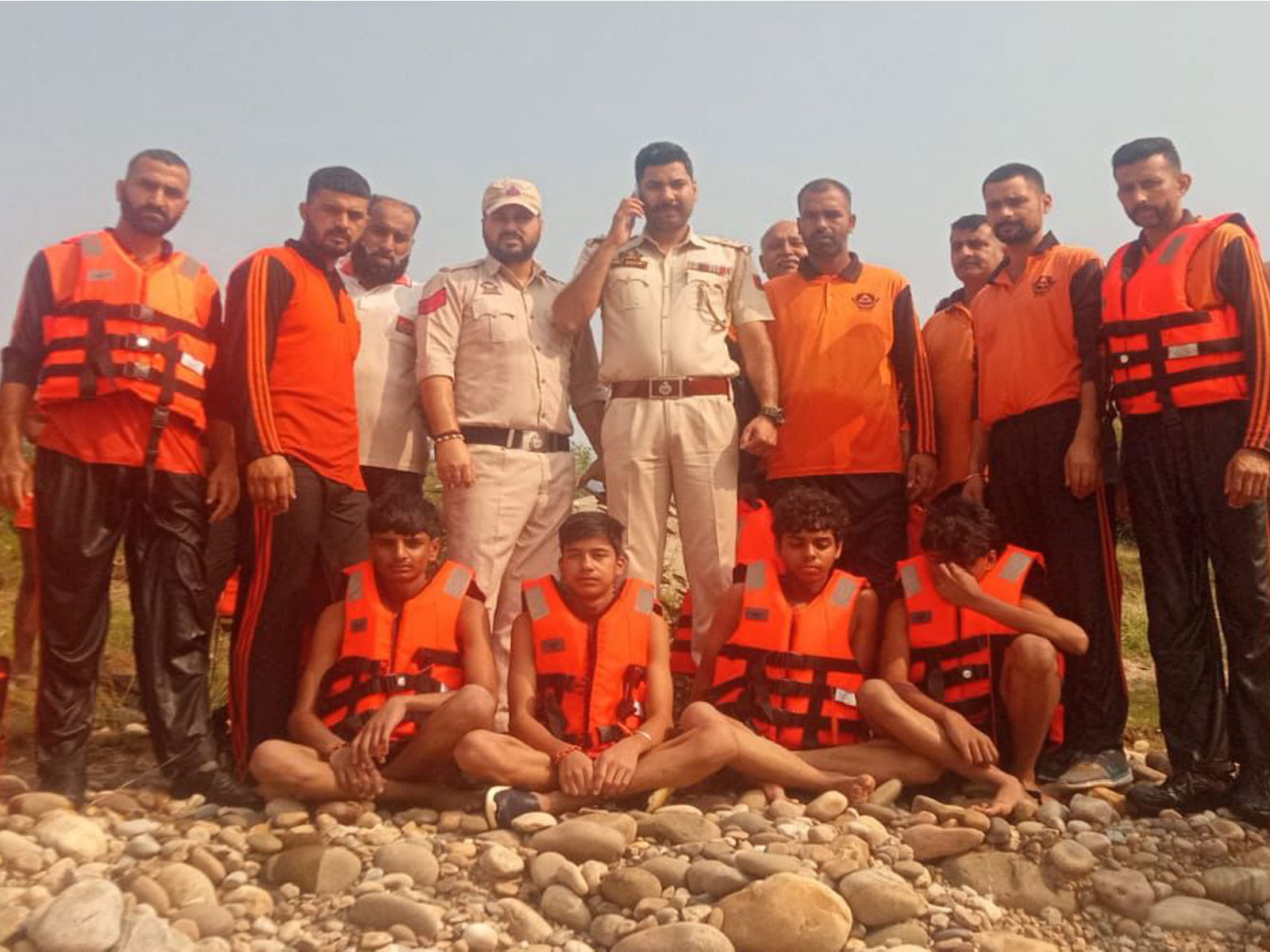 Jammu Police and the State Disaster Response Force (SDRF) along with four rescued children (Photo/ANI)