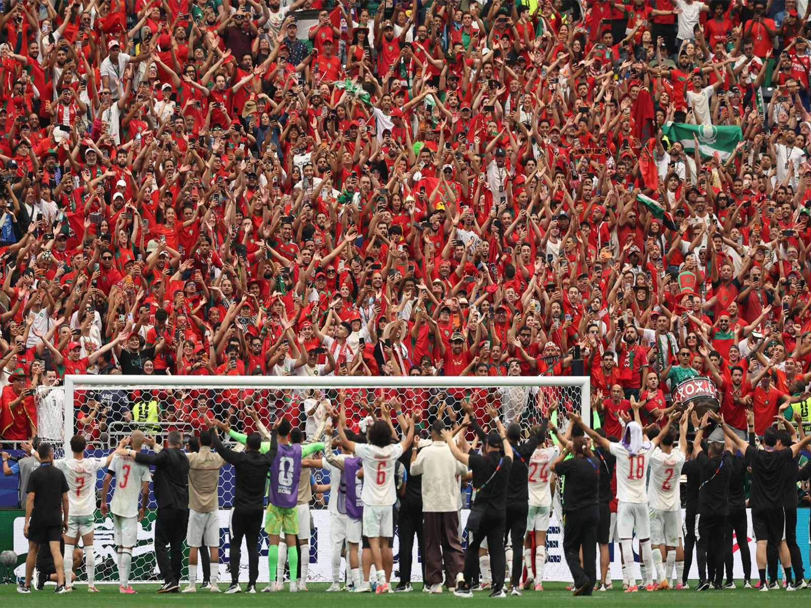 Soccer Football - FIFA World Cup 2026 - Round of 16 - Canada v Morocco - Houston Stadium, Houston, Texas, U.S. - July 4, 2026 Morocco players and fans celebrate after the match as Morocco qualify for the quarter-finals. (Photo: Reuters)