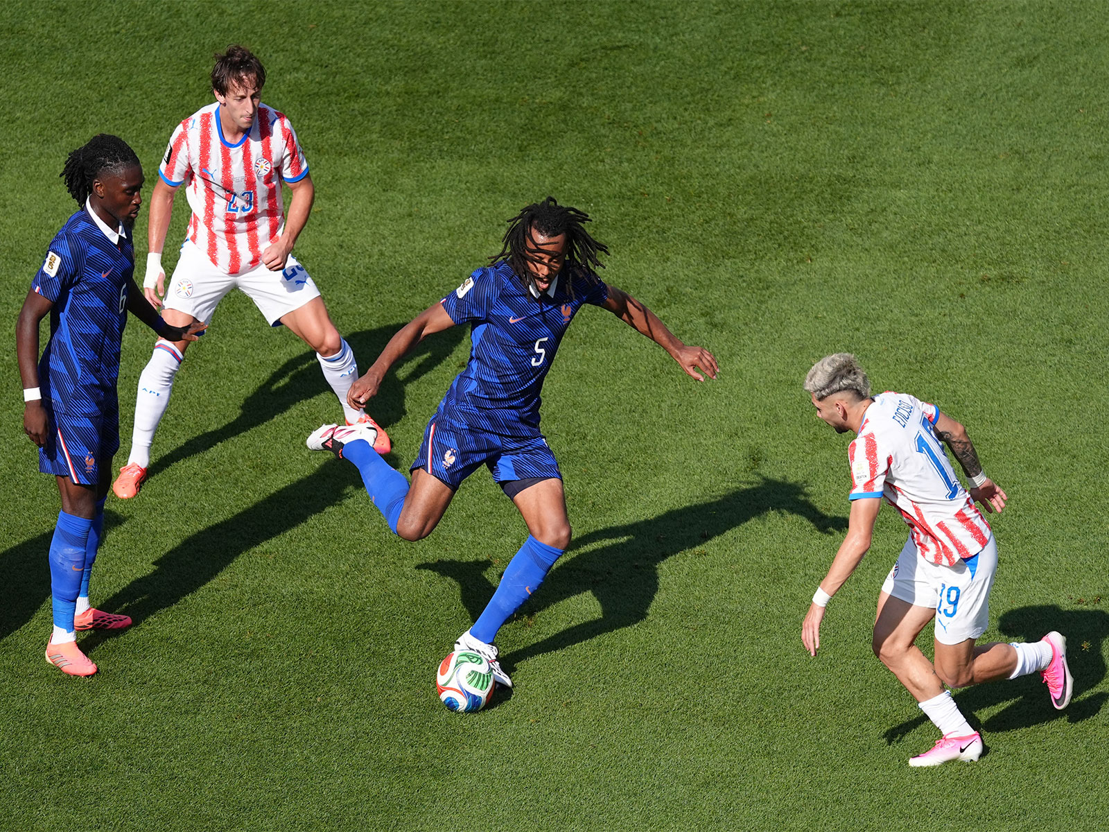 Soccer Football - FIFA World Cup 2026 - Round of 16 - Paraguay v France France's Jules Kounde and Manu Kone in action with Paraguay's Julio Enciso and Paraguay's Matias Galarza (Photo: IMAGN IMAGES via Reuters/Kyle Ross)