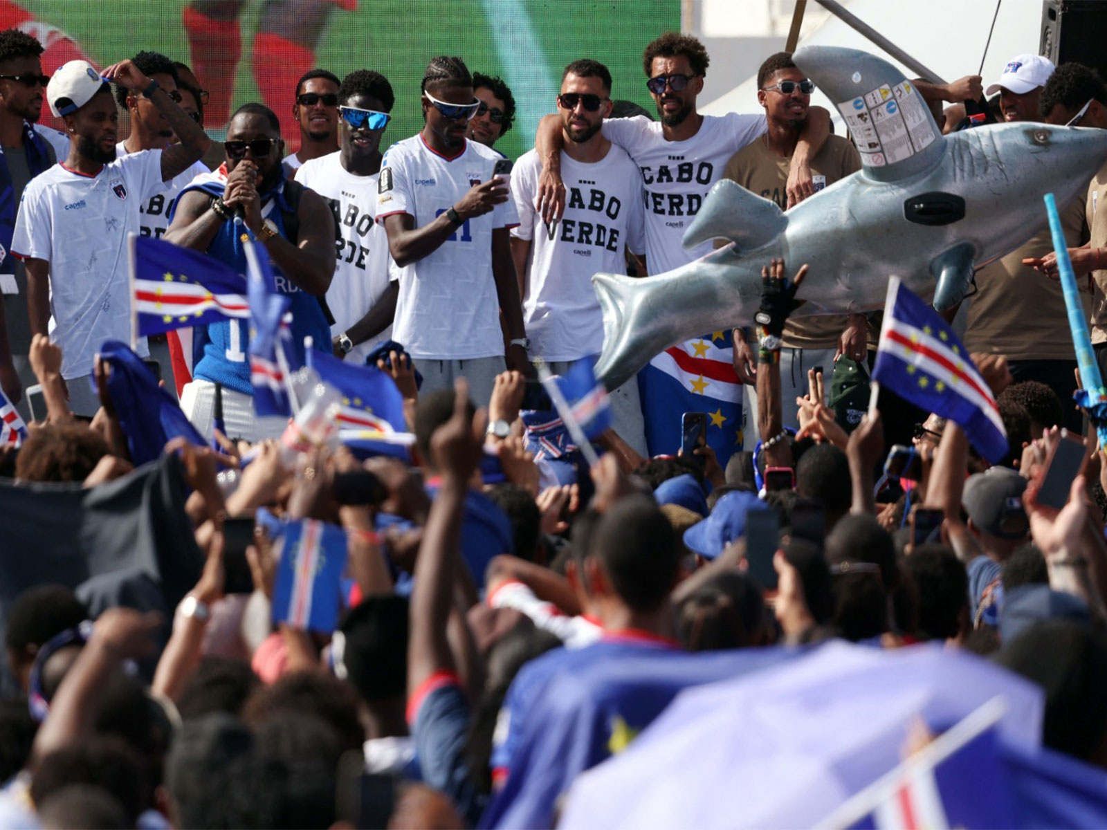 Cape Verde's Vozinha with Roberto Lopes and teammates as they celebrate with fans after arriving from the United States. (Photo/Reuters)