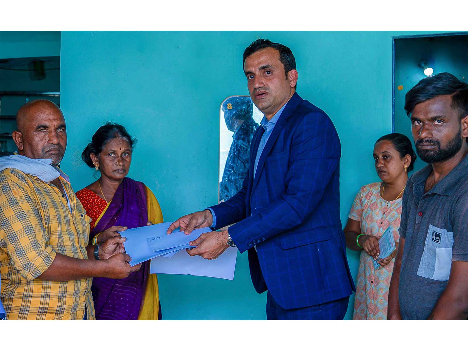 Dr. Shamsheer Vayalil's representatives hand over support to the parents of late Thirupathi Gollapally in Telangana