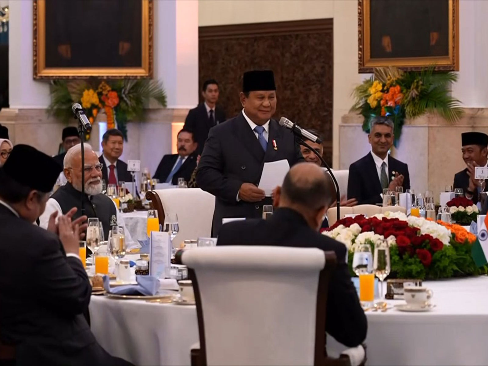 Prime Minister Narendra Modi smiles as Indonesian President Prabowo Subianto praises India's development model during a banquet lunch in Jakarta on Tuesday. (Photo: ANI/DD News)