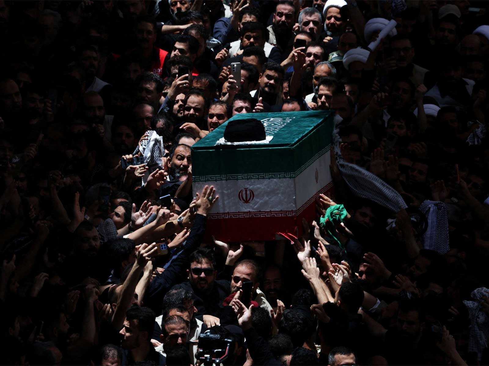 The coffin of Iran's late Supreme Leader Ayatollah Ali Khamenei carried during a funeral procession at the Imam Ali Shrine in Najaf, Iraq (Photo/Reuters)