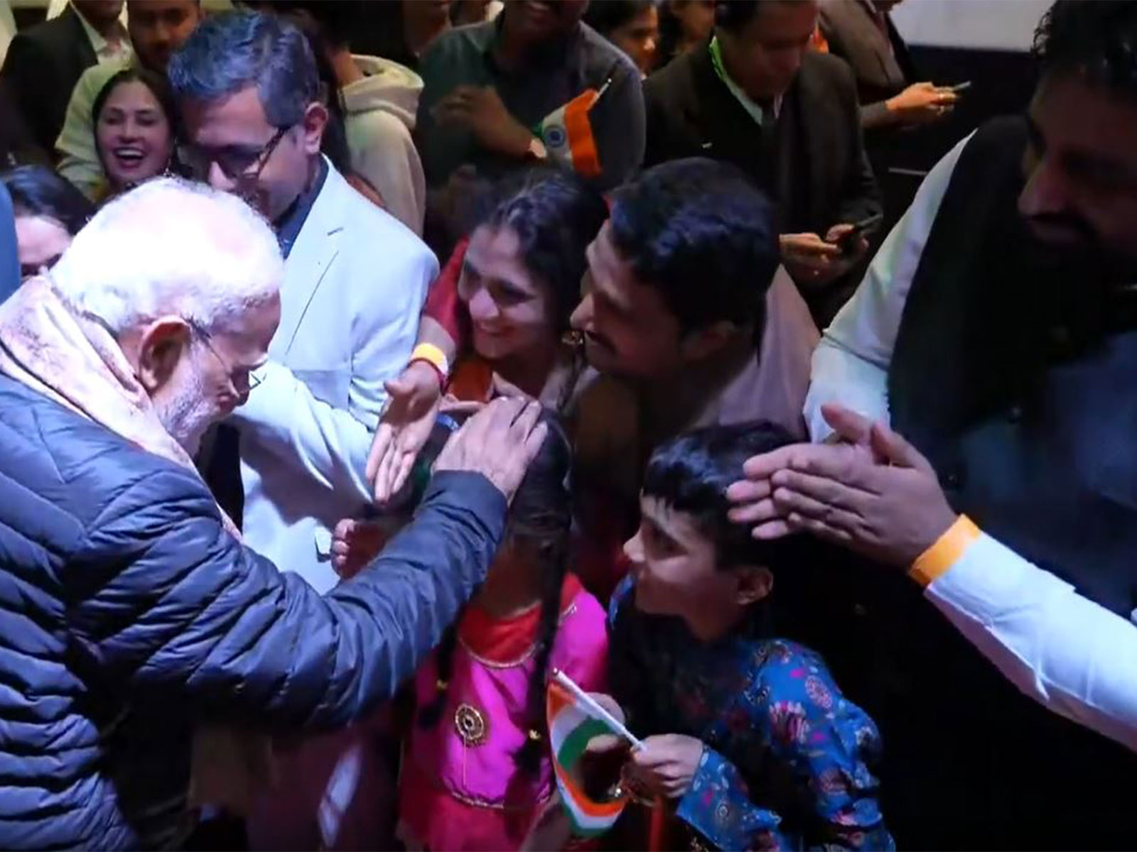 PM Modi with Indian community members (Photo/ANI)