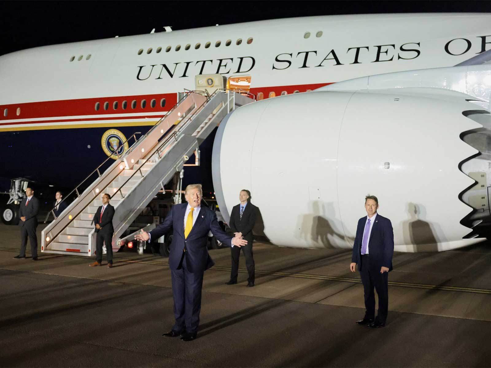 US President Donald Trump gestures during a stop to switch to the Qatari-gifted Air Force One (Photo/Reuters)