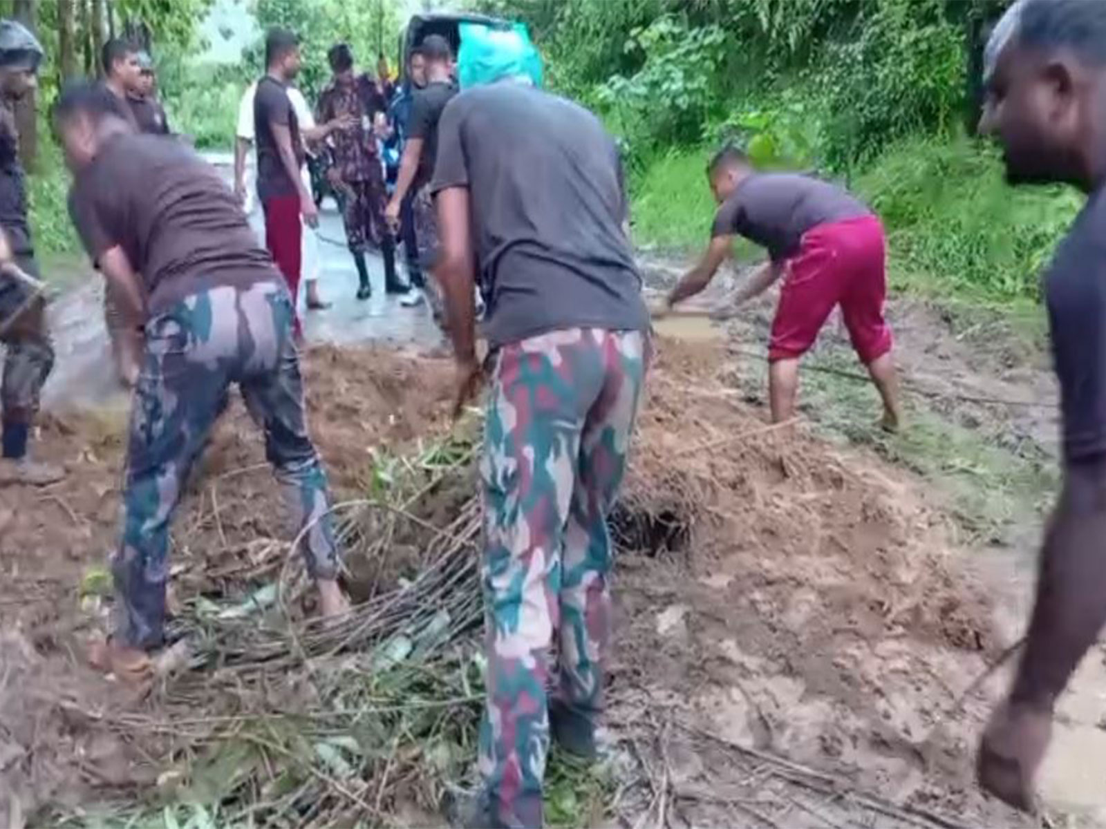 Members of the Border Guard Bangladesh (BGB) have stepped in to restore the communication and transport networks shattered by recent flash floods and devastating landslides in Bandarban (Photo/BGB)