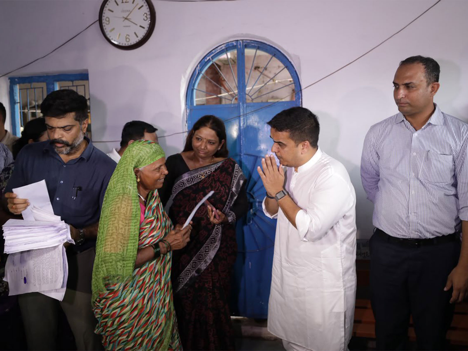 Gujarat Deputy Chief Minister Harsh Sanghavi distributing ex-gratia to flood affected families. (Photo:X@sanghaviharsh)