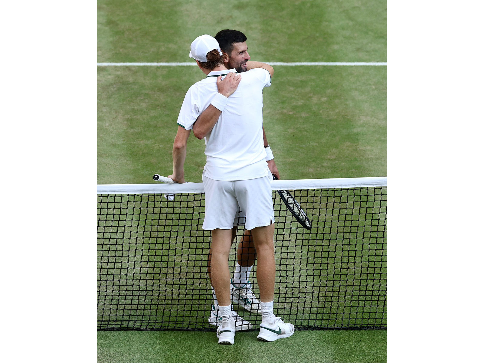 Jannik Sinner hugging Novak Djokovic after defeating the Serbian legend in the Wimbledon men's singles semifinal. (Photo: X/@janniksin)