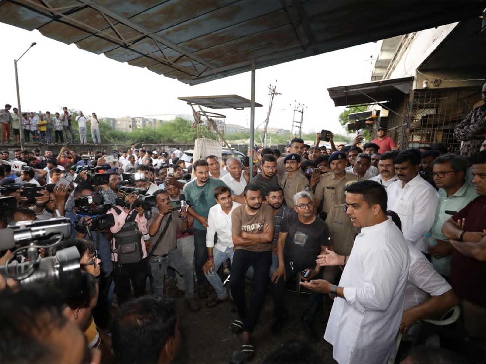 Gujarat Deputy CM Harsh Sanghavi visits rain-hit Maruti Industrial Estate in Pandesara and Millennium Textile Market in Surat to assess the impact of heavy rains (Photo: Gujarat CMO)