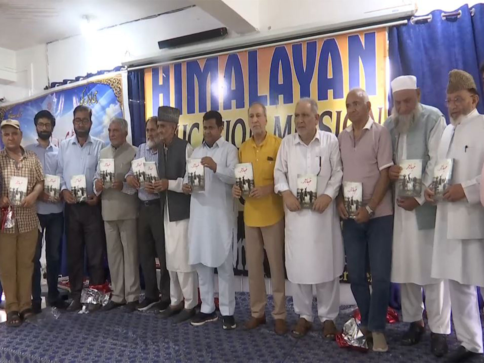 Launch of "Muhajer", a Pahari language novel authored by Mohammad Iqbal Shawl during a literary meet in Rajouri, Jammu and Kashmir (Photo/ANI)