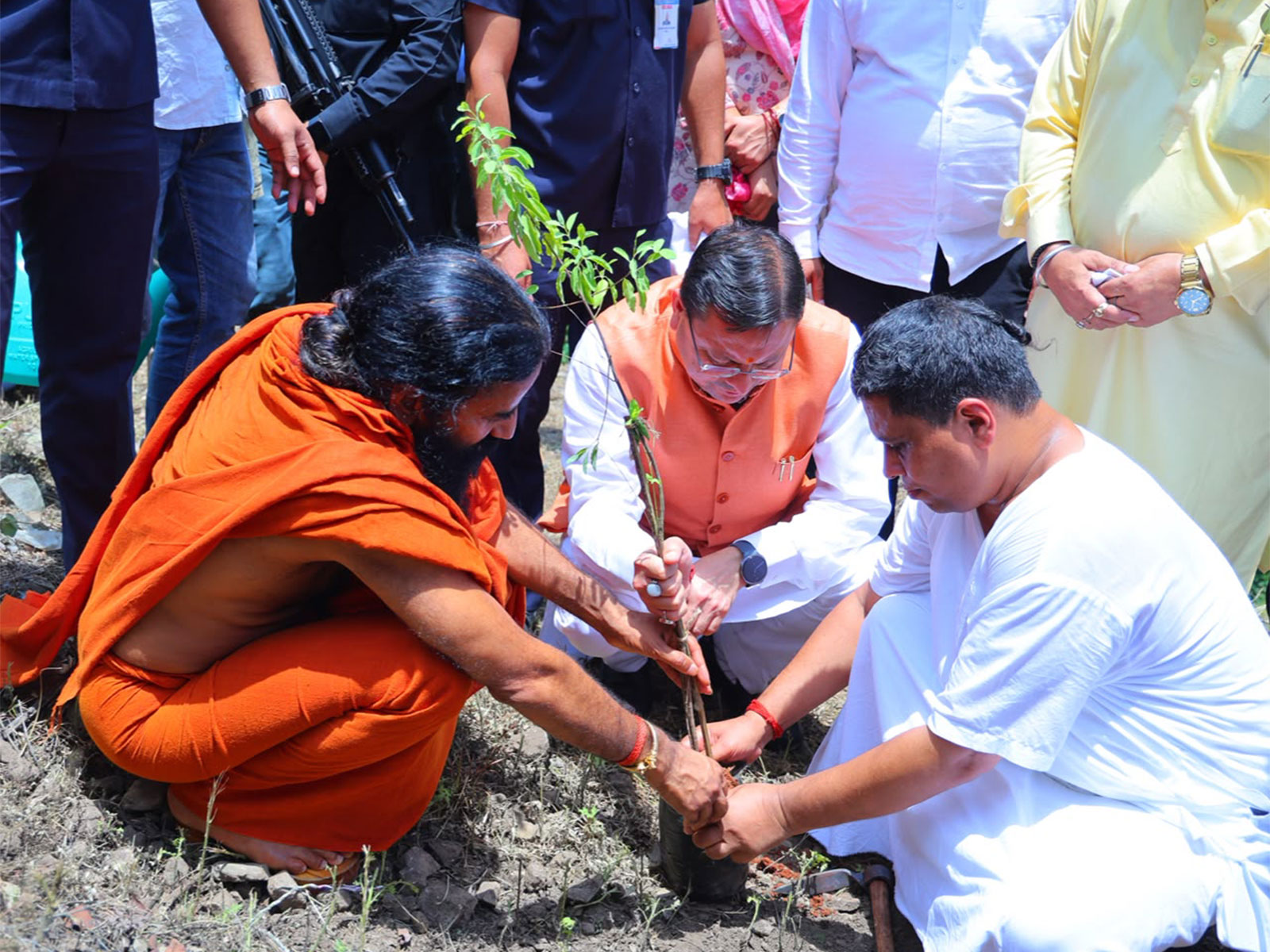 Uttarakhand Chief Minister Pushkar Singh Dhami with Yog Guru Baba Ramdev (Photo/ANI)
