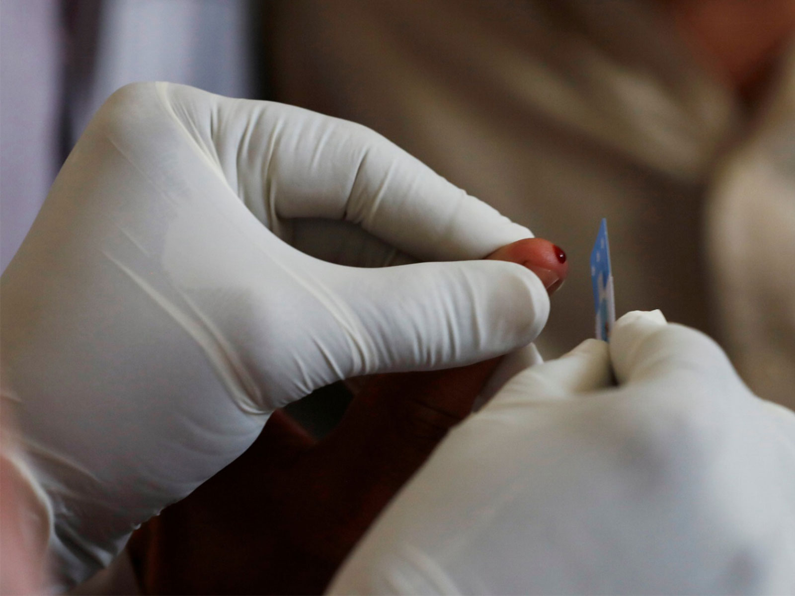 A medical worker draws blood for a HIV test at the free medical camp in Pakistan (File Photo/Reuters)