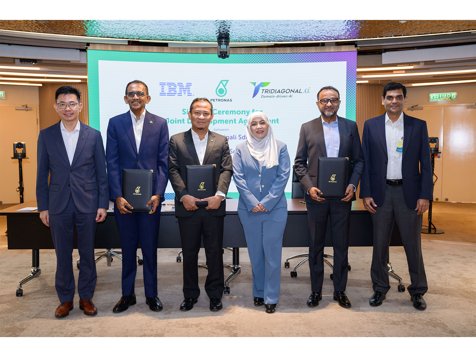 Signing ceremony for the third TriCipta AI Joint Development Agreement, attended by executives from Tridiagonal.ai (T.AI), PETRONAS Carigali, and IBM Malaysia.