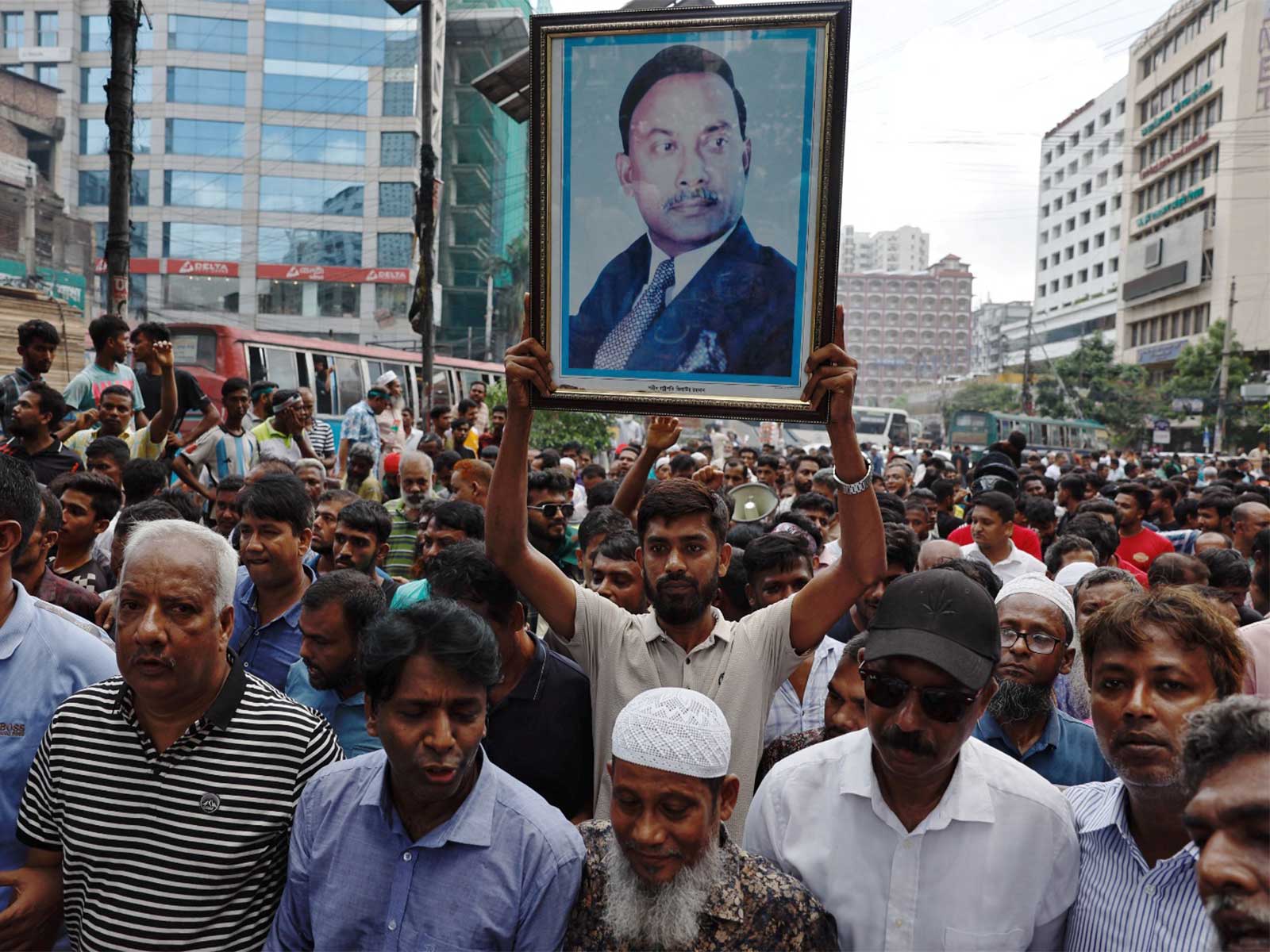 Supporter of Bangladesh Nationalist Party (BNP) holds a picture of former President Ziaur Rahman (File Photo/Reuters)