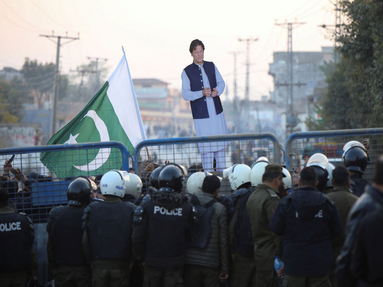 A supporter holds a cutout of former Prime Minister of Pakistan and Leader of Pakistan Tehreek-e-Insaf (PTI) party Imran Khan during a protest in Pakistan (File Photo/Reuters)